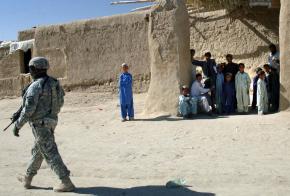 A U.S. soldier moves through Pana, Afghanistan, during a cordon and search