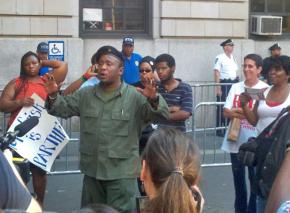 Supporters of anti-police brutality activist Jazz Hayden listen to a speaker outside the 32nd Precinct