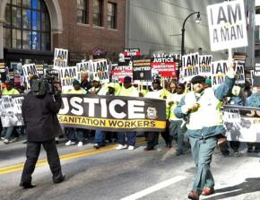 DeKalb County sanitation workers march down Peachtree Street in downtown Atlanta