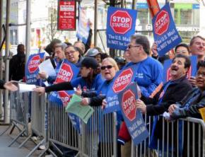 Members of the APWU picket outside Staples